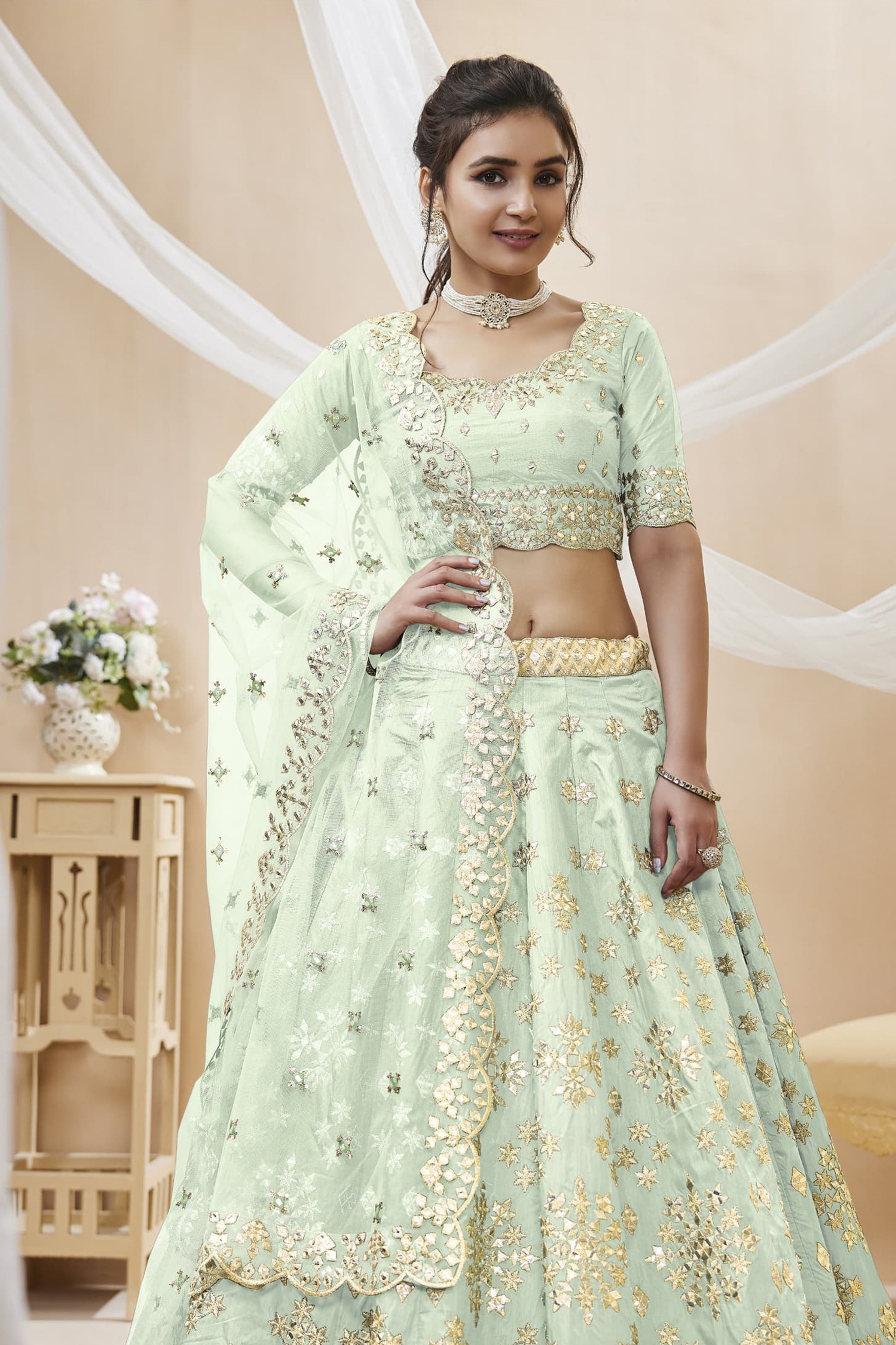 close-up of sequins work on white art silk lehenga