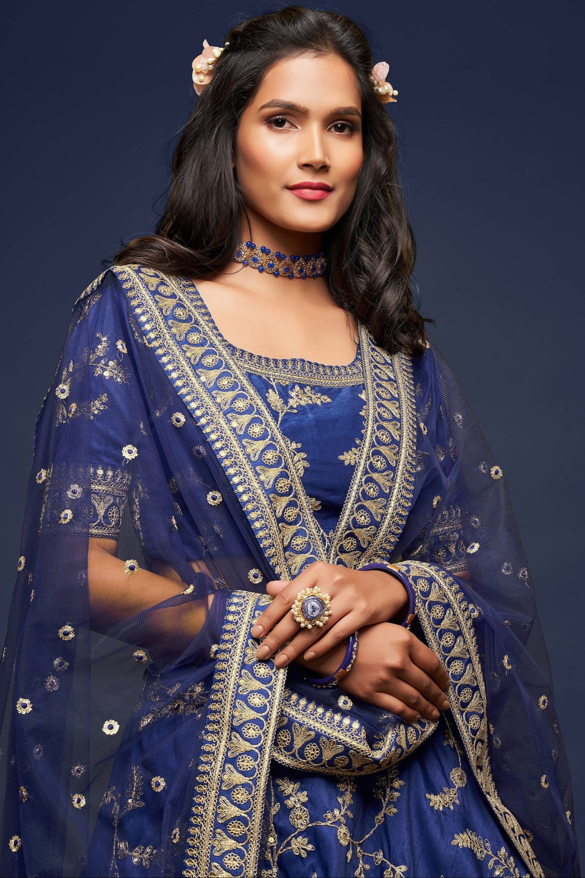 Close-up of sequins work on navy blue lehenga fabric