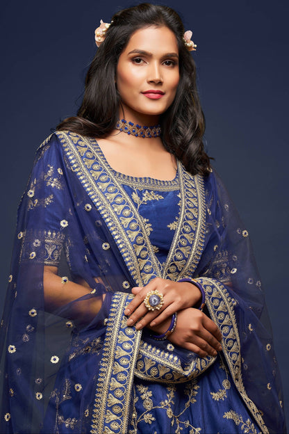 Close-up of sequins work on navy blue lehenga fabric