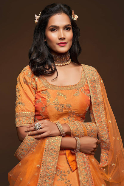 Close-up of thread embroidery on art silk bridal lehenga