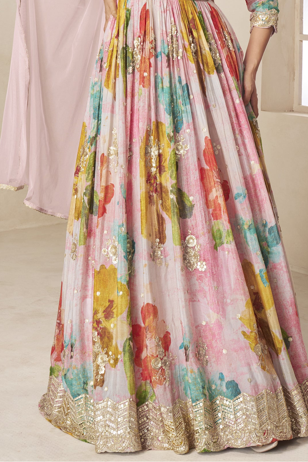Flared silhouette of baby pink anarkali gown for festive events