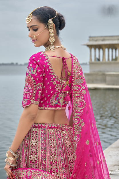 Back view highlighting intricate work on light pink lehenga