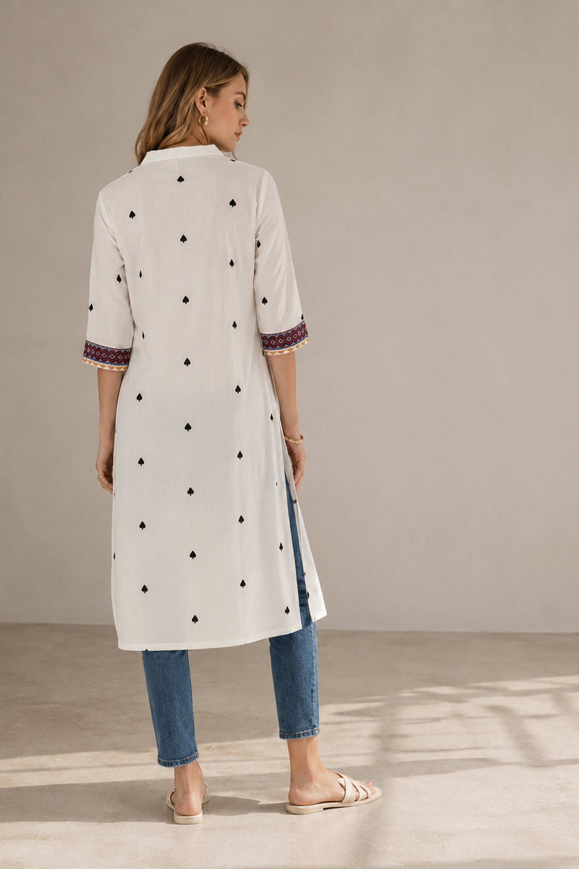 back view of white kurti with side slit styling