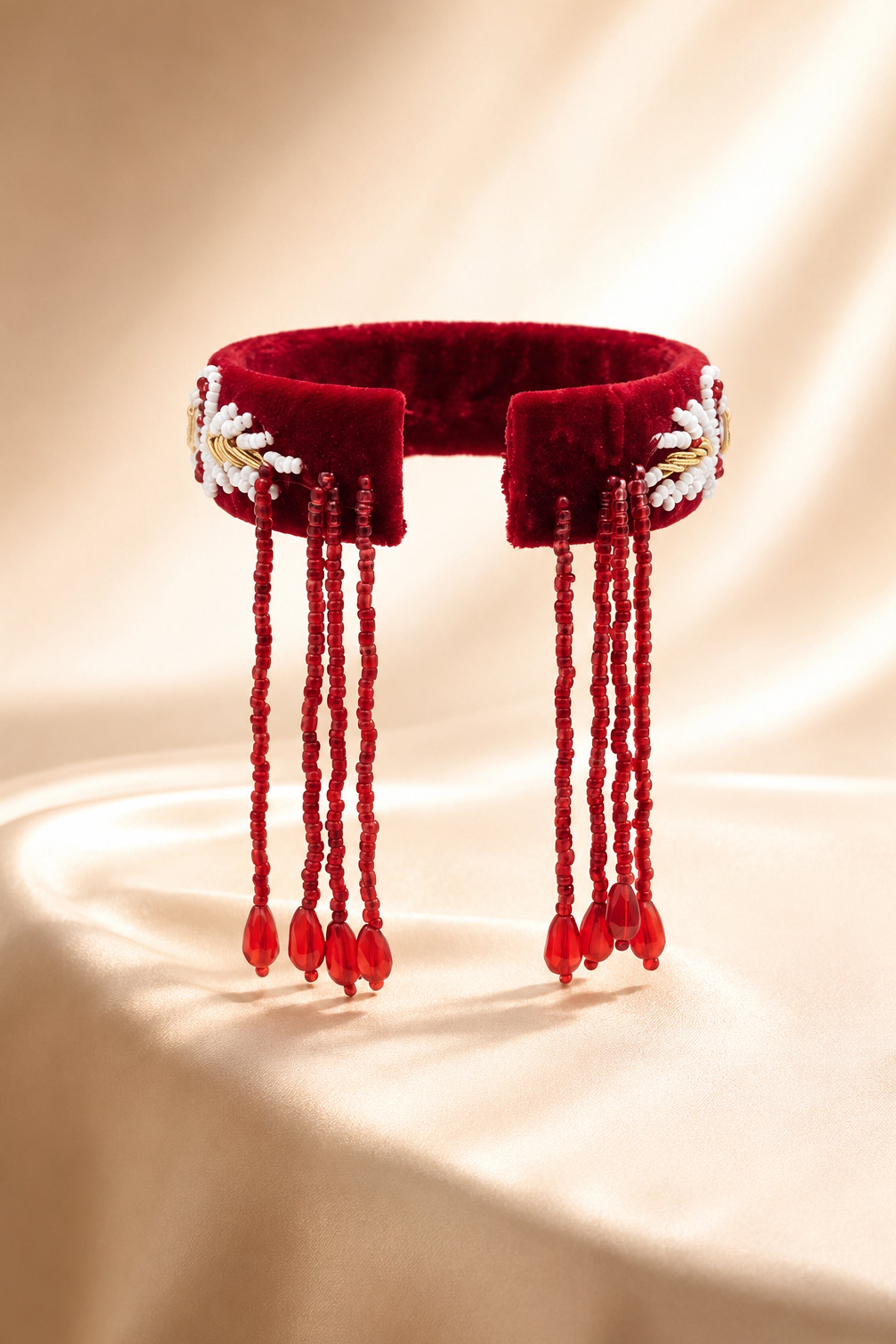 Open-back view showing the long maroon bead strands and teardrop ends