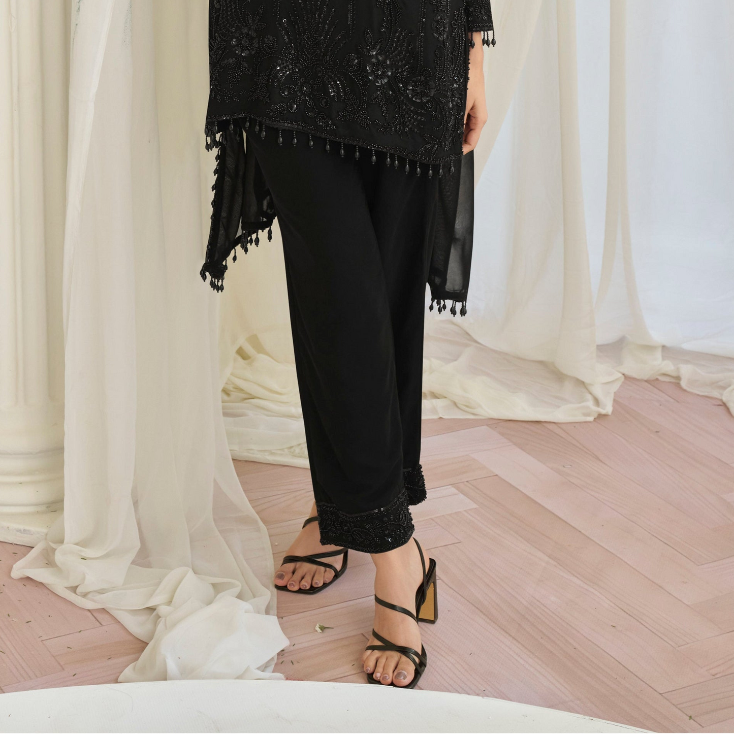 Hem detail with embroidery on black salwar kameez