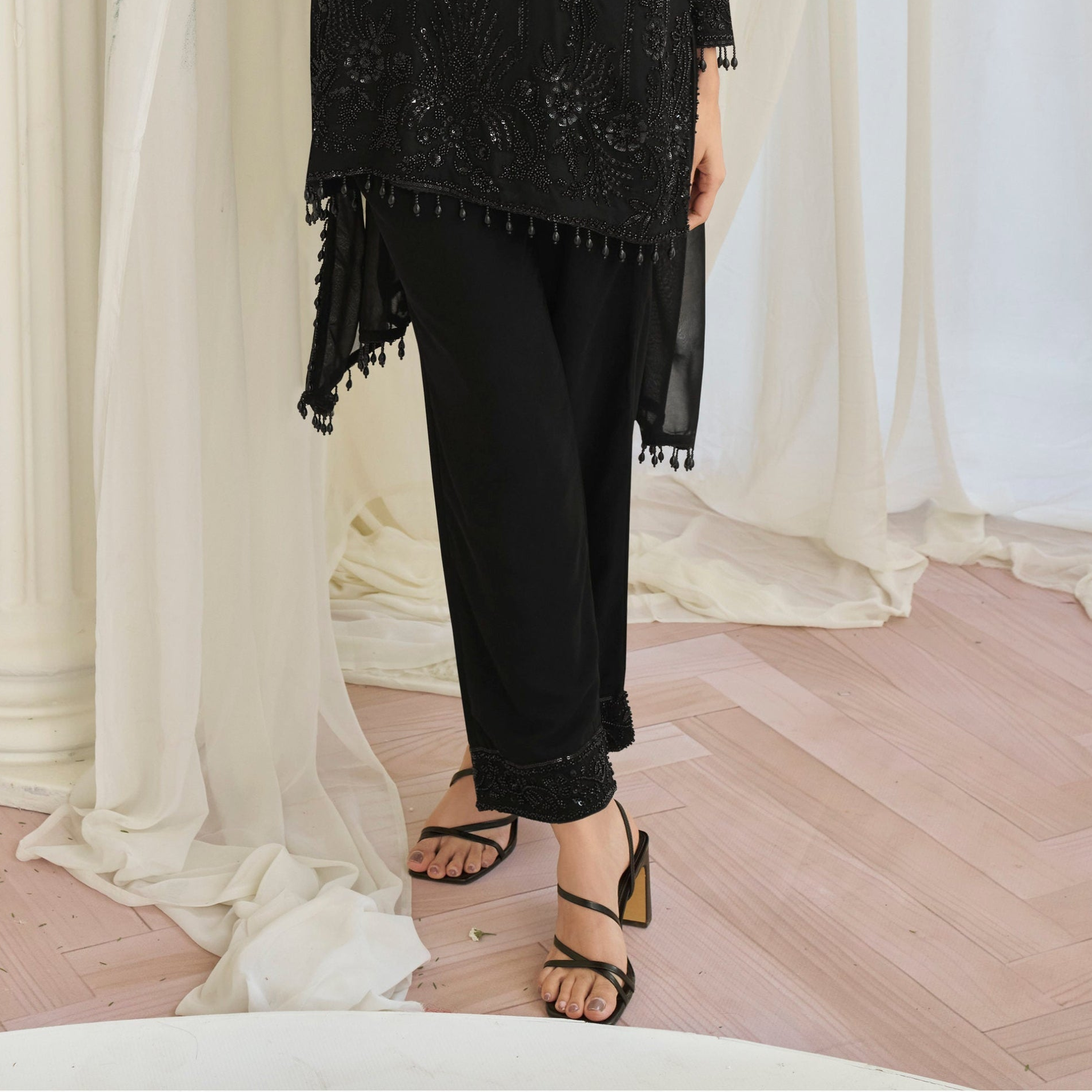 Hem detail with embroidery on black salwar kameez