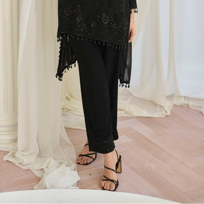 Hem detail with embroidery on black salwar kameez
