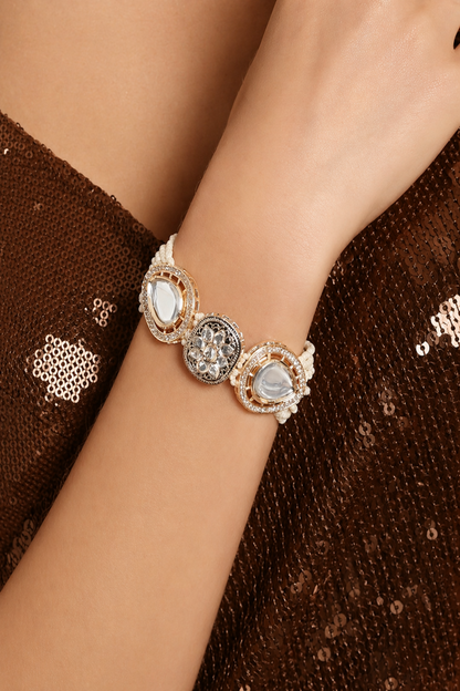close up of beaded bracelet with geometric center detail