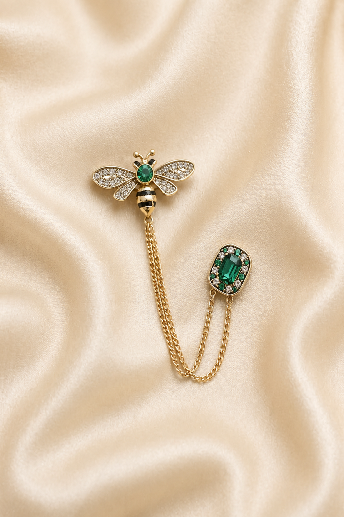 bee brooch pin with green stone and chain detail