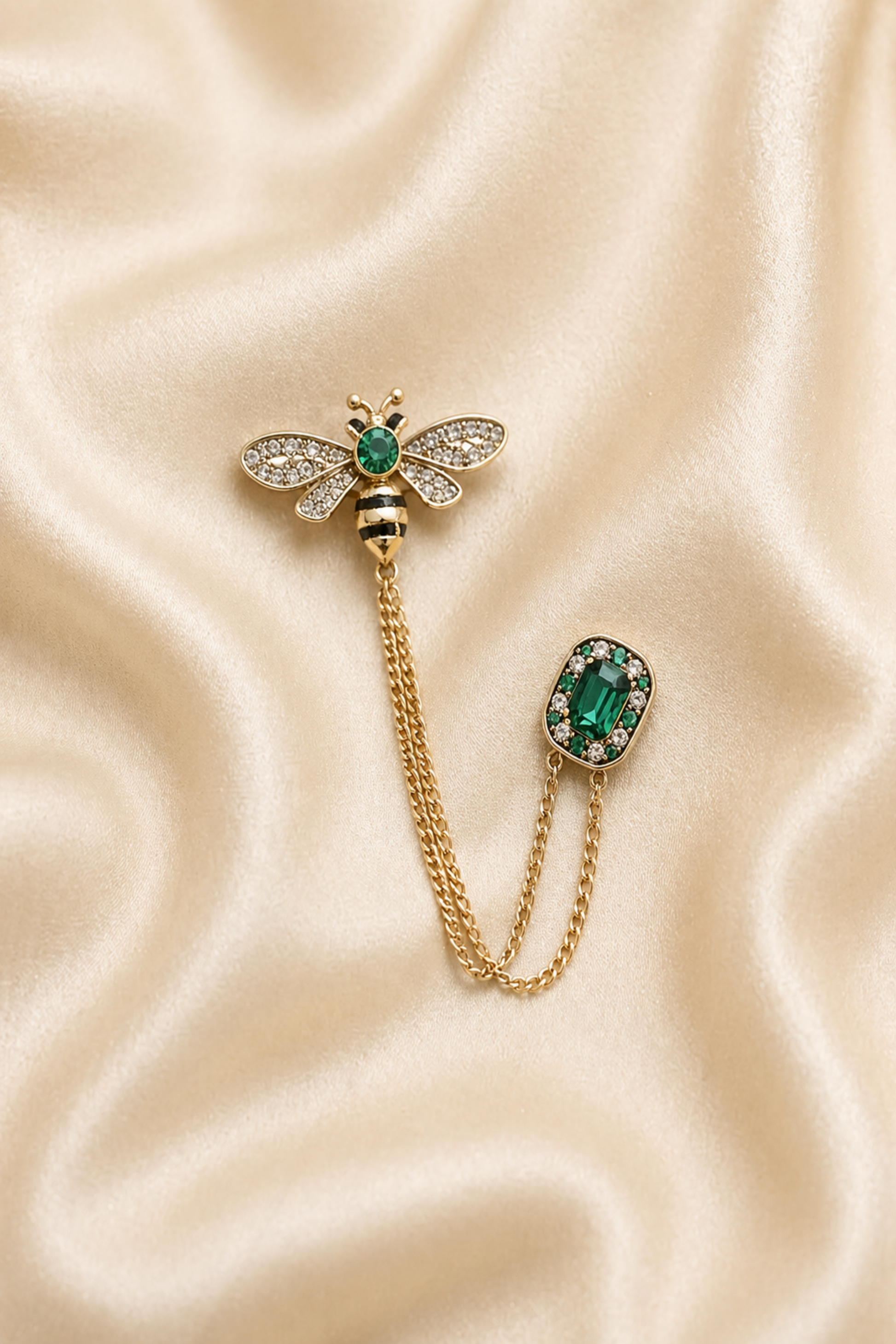 bee brooch pin with green stone and chain detail