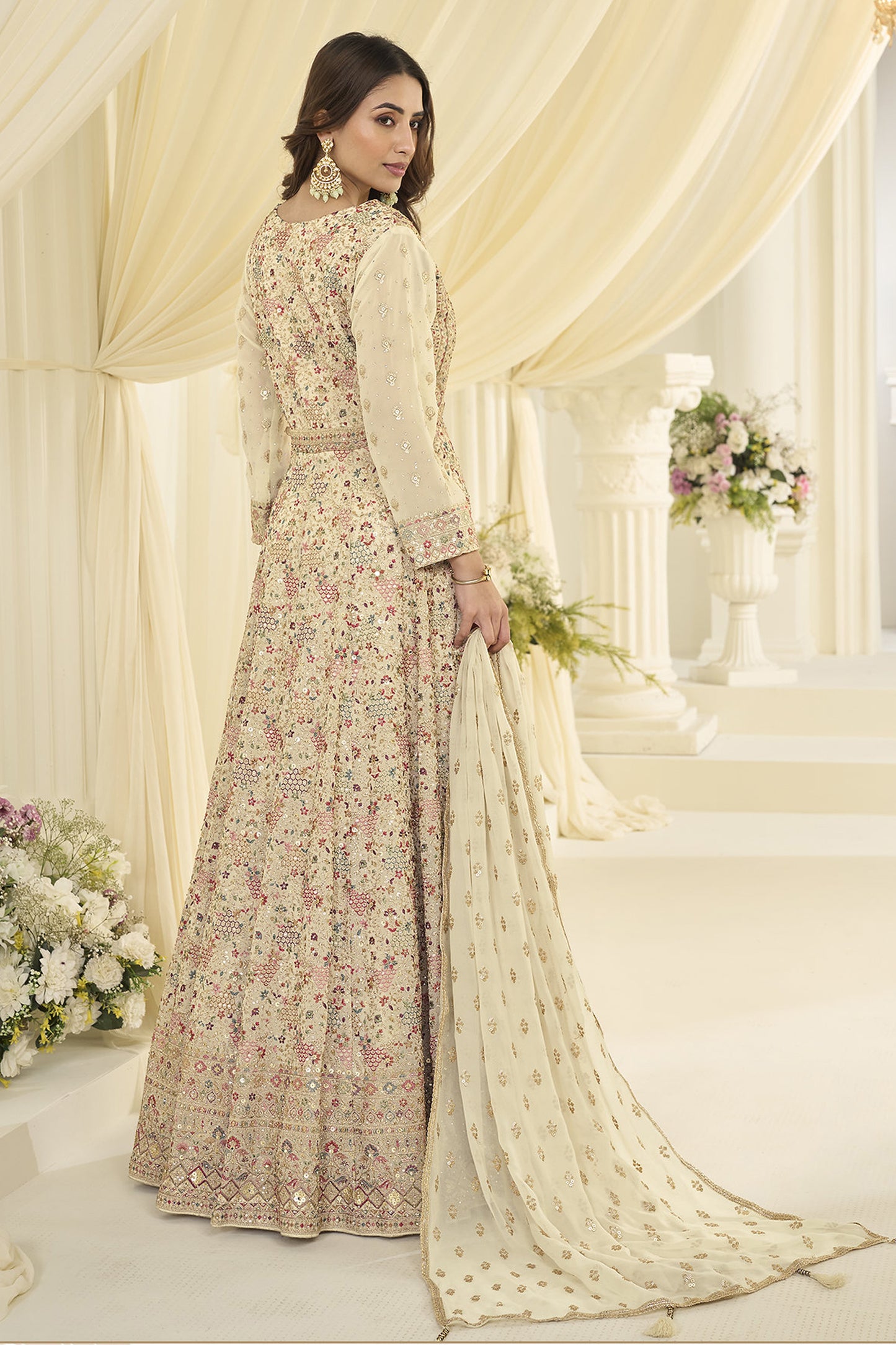 Back view of beige anarkali outfit with flowy silhouette