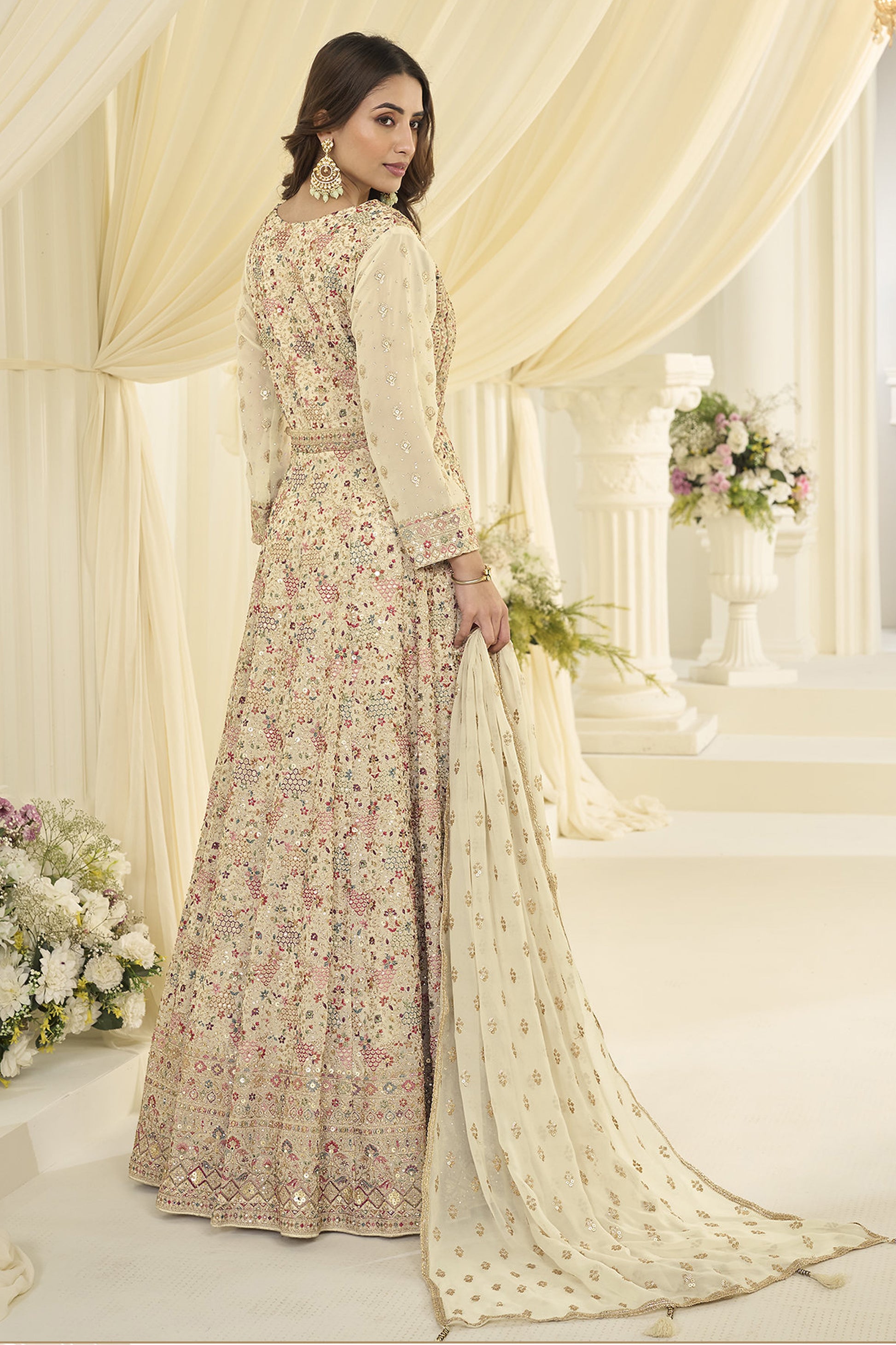 Back view of beige anarkali outfit with flowy silhouette
