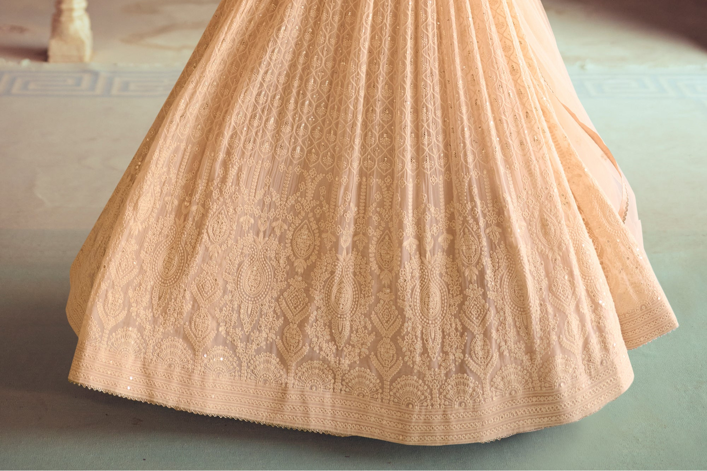Hem detail of beige anarkali with wide flare