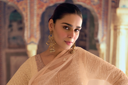 Close up of embroidery on beige anarkali dress