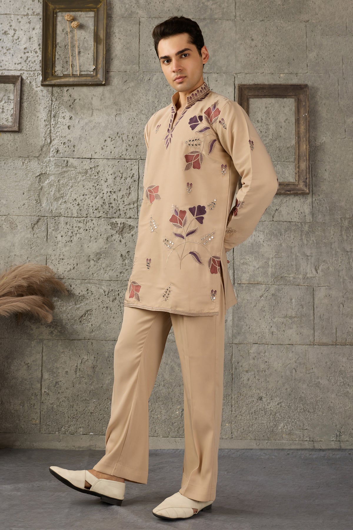 Hem detail of the beige kurta with embroidery