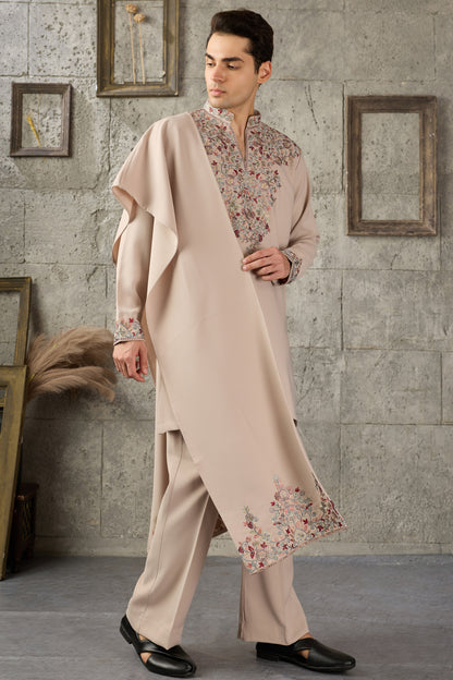 Close-up of thread embroidery on beige kurta