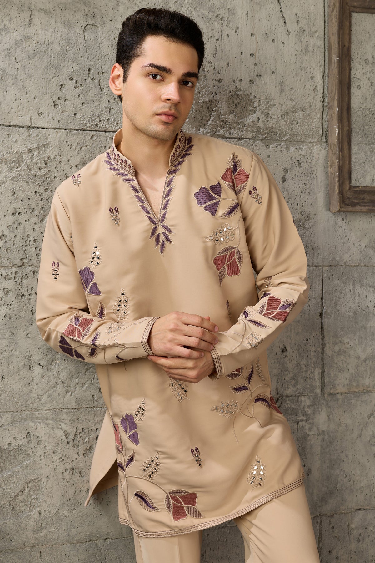 Hem detail of the beige kurta with embroidery