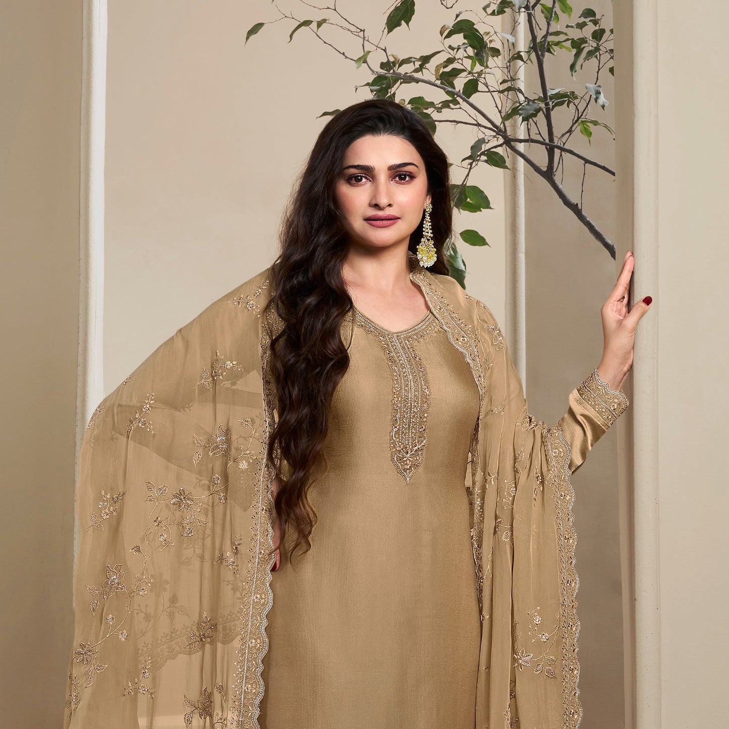 Beige salwaar kameez with heavy embroidery close-up view