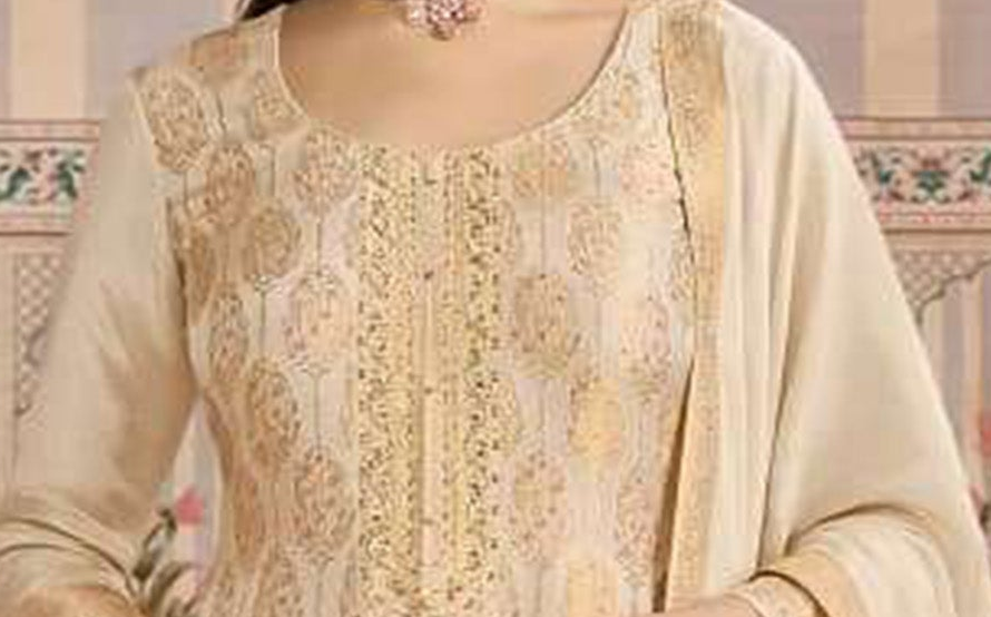Sleeve detail of beige embroidered suit