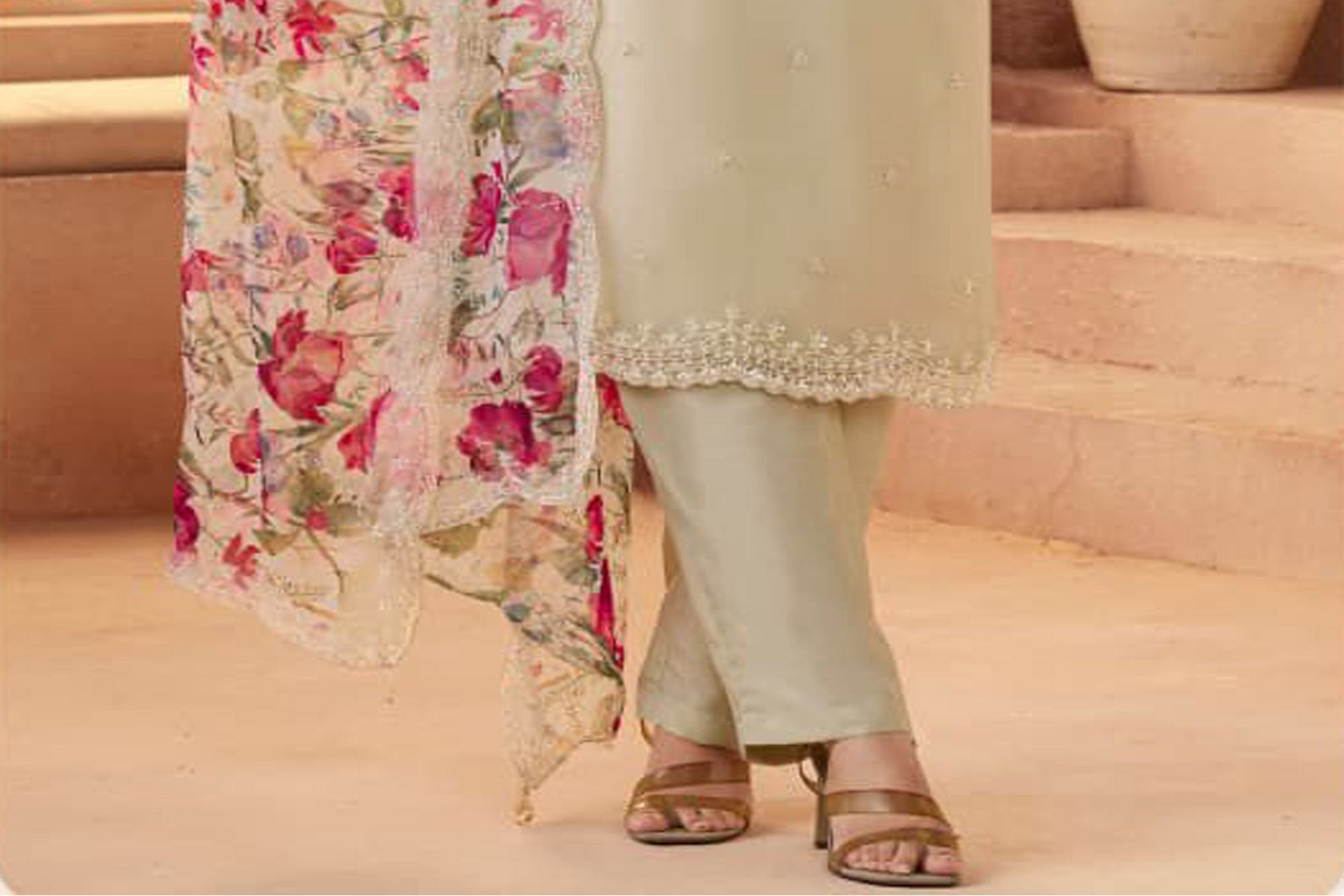 Close-up texture of embroidery on Beige salwar kameez