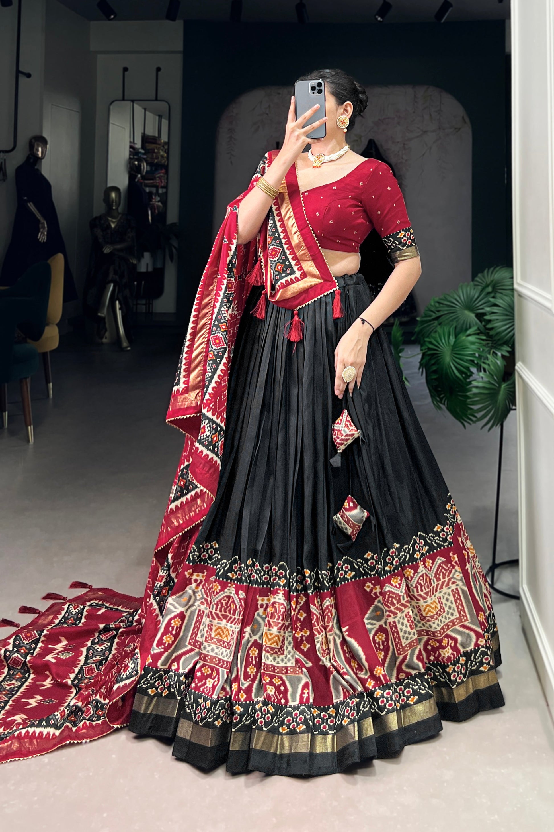 black lehenga choli dupatta styling detail
