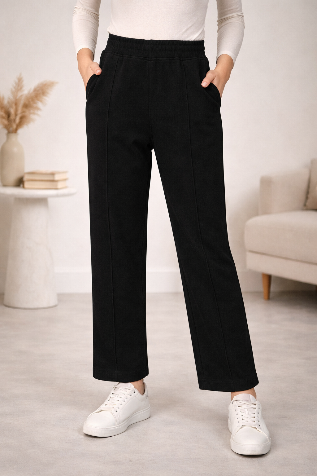 black work pants paired with a neutral top