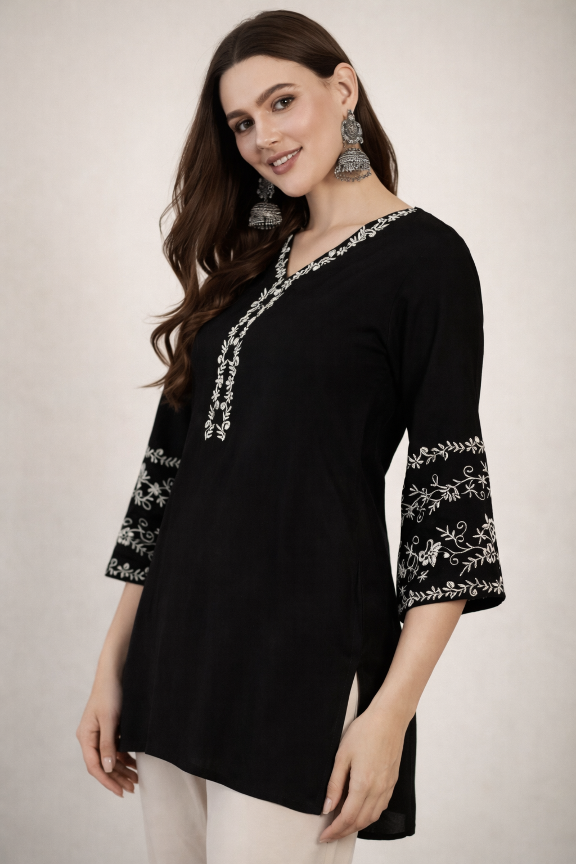 Side profile of black tunic for everyday office wear