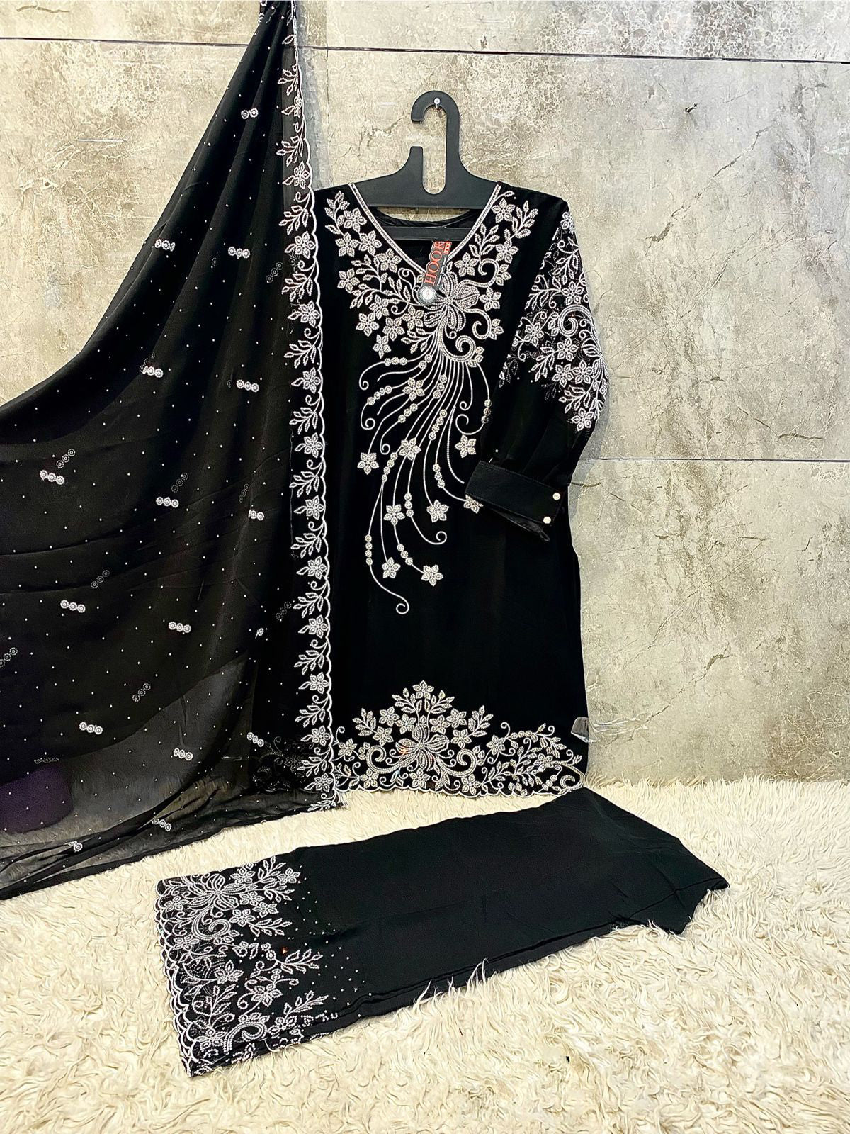 Black palazzo set showcasing embroidery and zarkan detailing