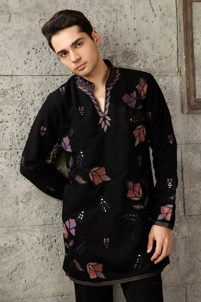 Hem detail of the black kurta with embroidery