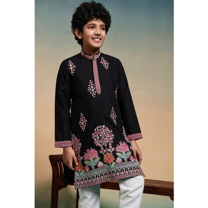 close up of multicolor thread and sequin embroidery on kurta