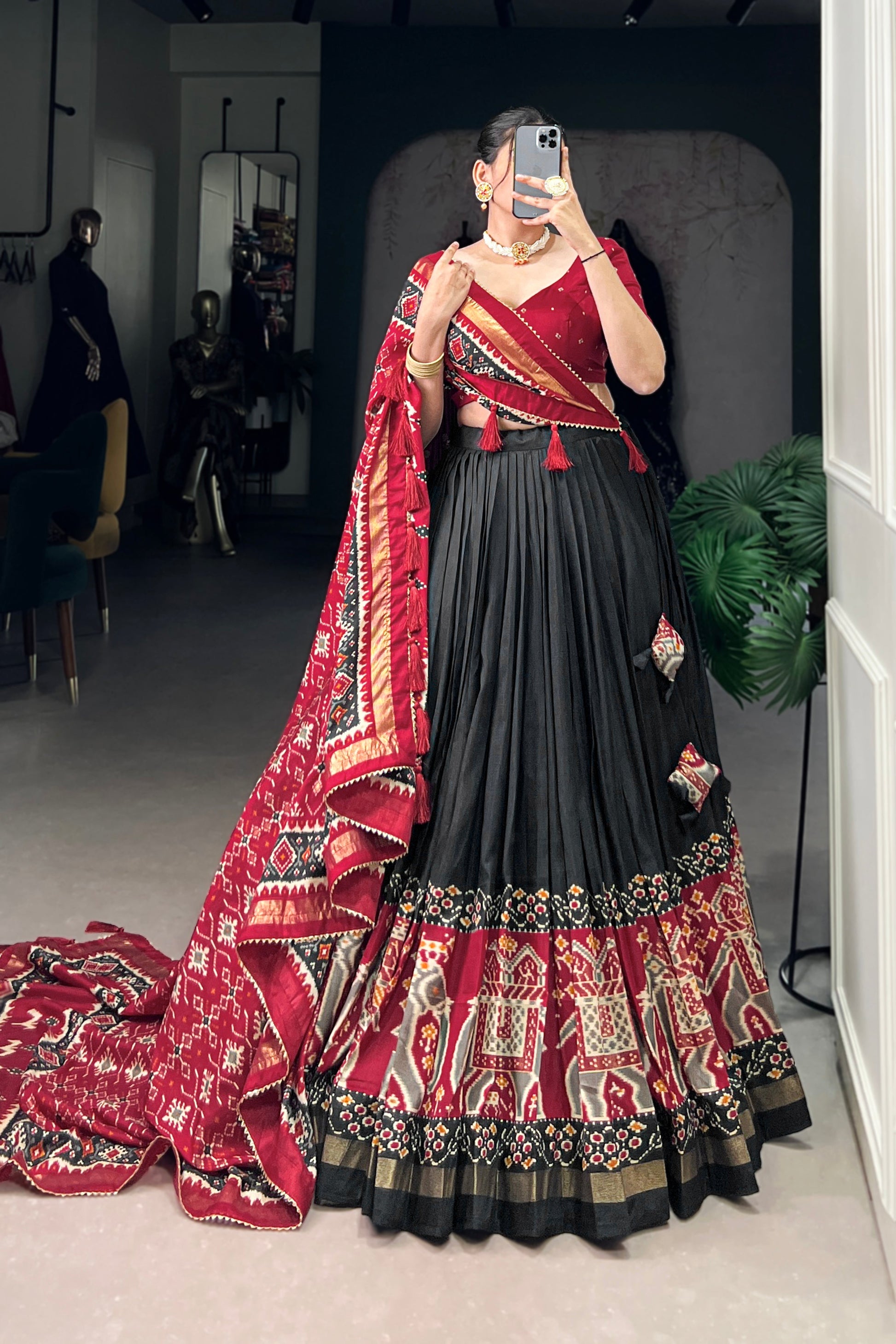 black lehenga front view with floral foil print
