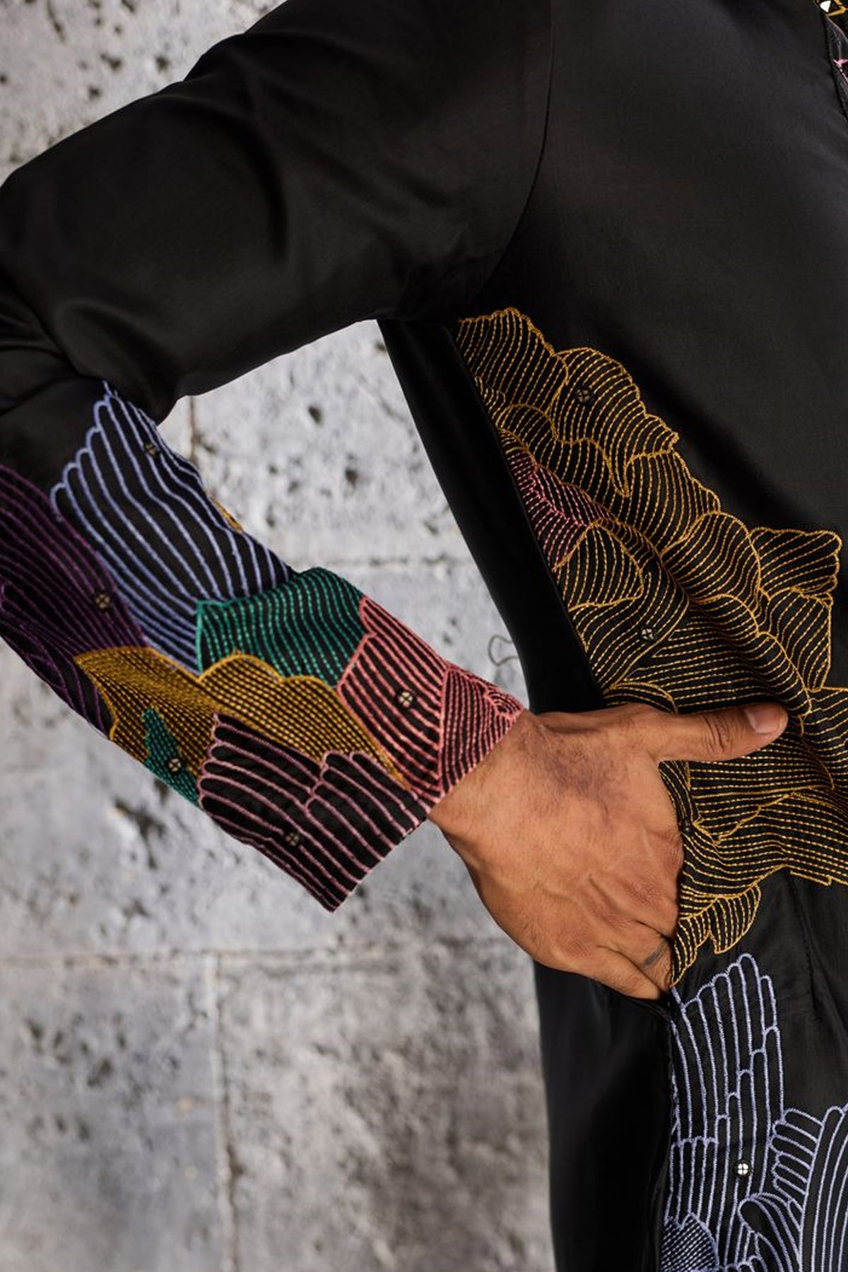 Front view of black embroidered pajama set