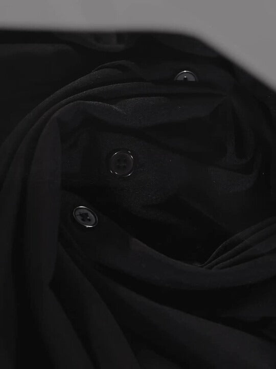 Fabric sheen detail of black polyester shirt