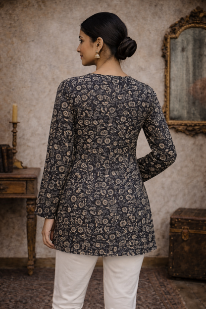 back angle of black printed tunic for weekday outfit styling