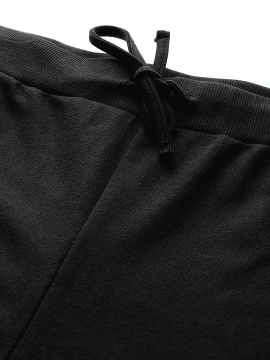 detail view of waistband and stitching on black pants