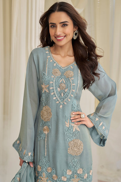 Close-up of beads embroidered work on blue kameez