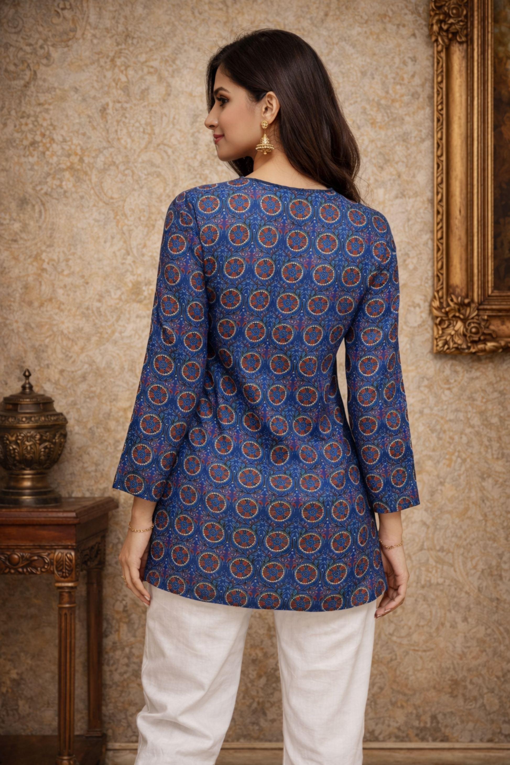 Side angle view of modern style tunic-inspired crop top