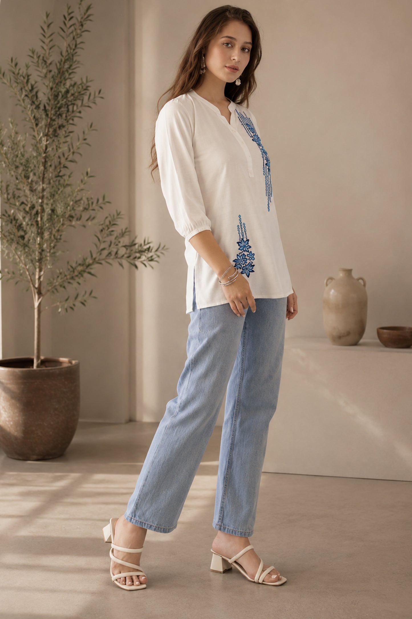 Casual white rayon tunic styled with light denim