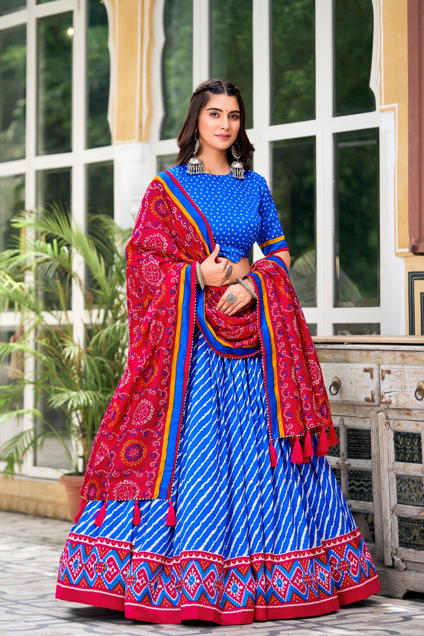Blue lehenga designs for wedding with red dupatta front view