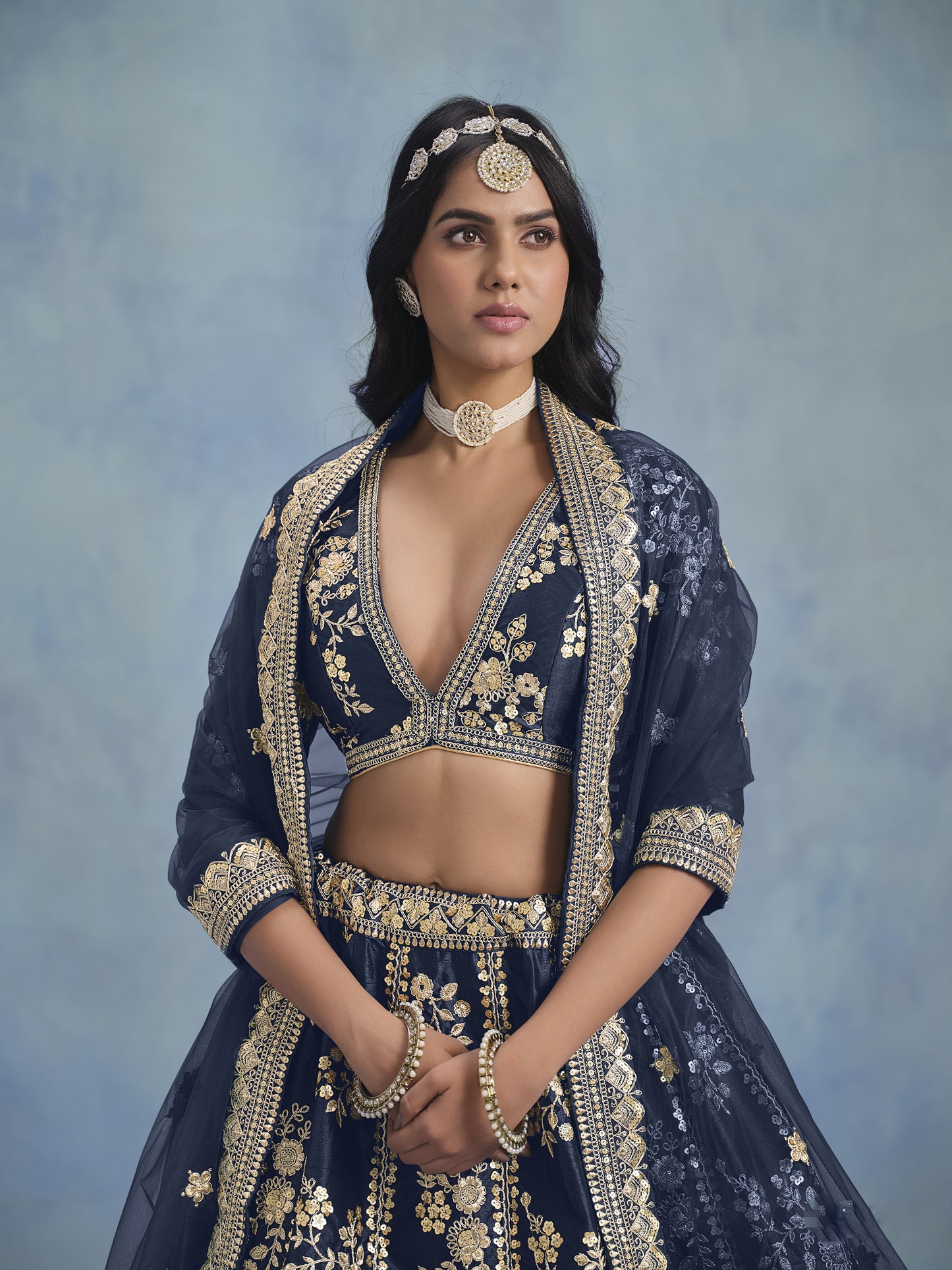 Traditional embroidery close-up on blue lehenga fabric