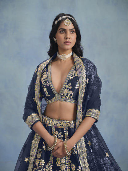 Traditional embroidery close-up on blue lehenga fabric