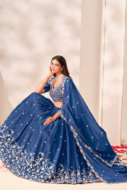 Blue dupatta paired with an embroidered lehenga choli.