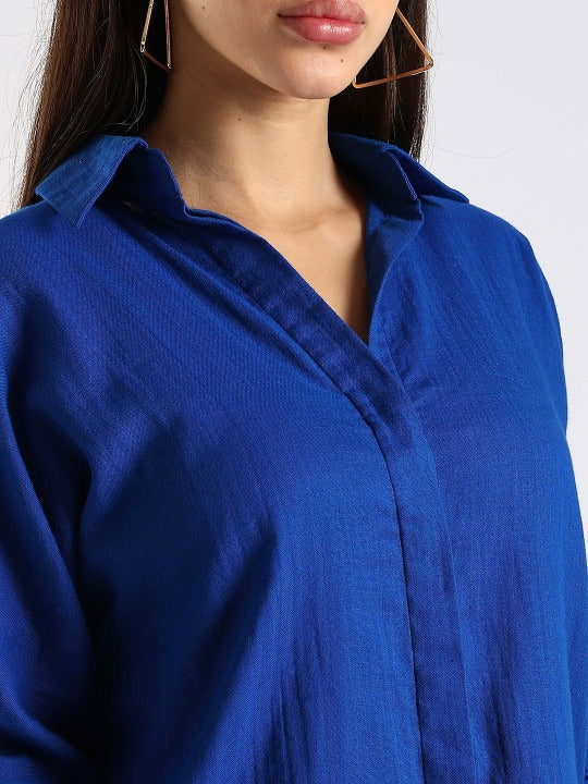 close-up of cotton fabric texture on blue womens shirt