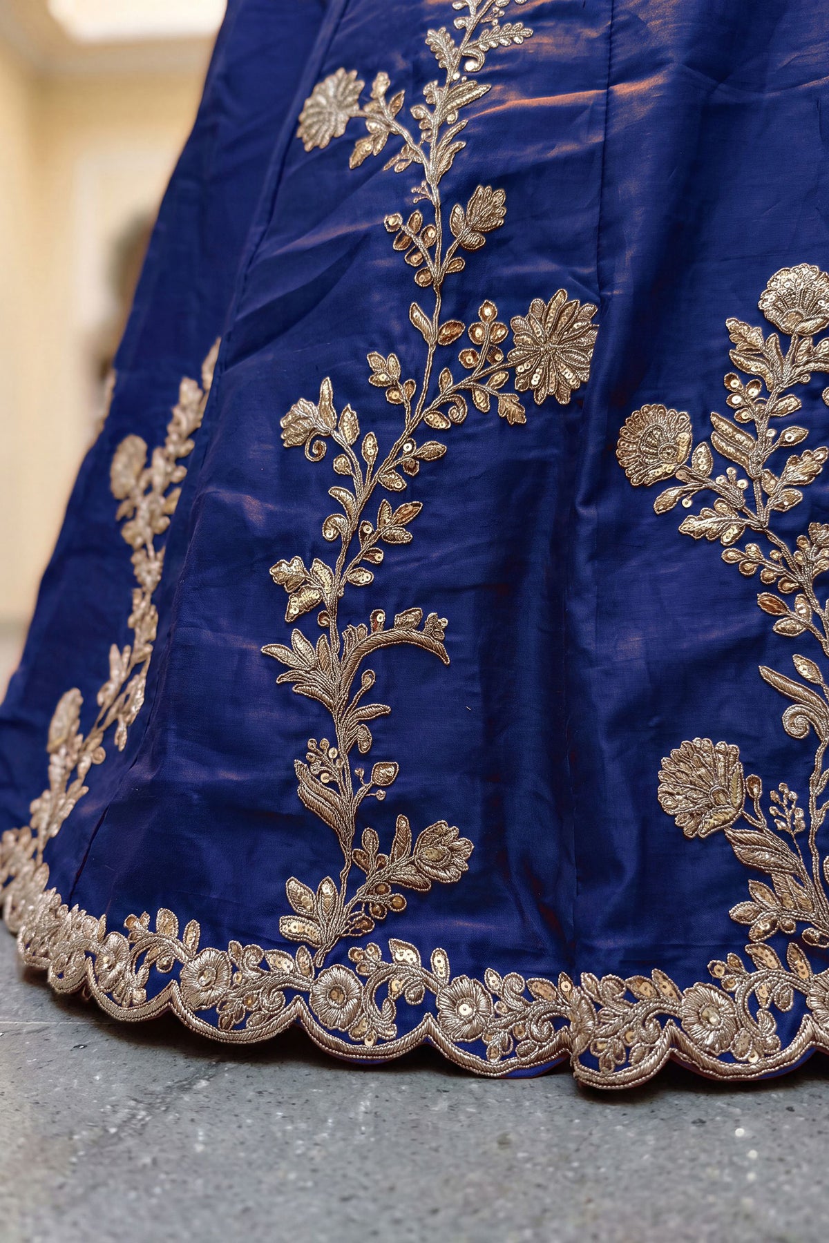 Rangoli silk fabric texture on blue lehenga