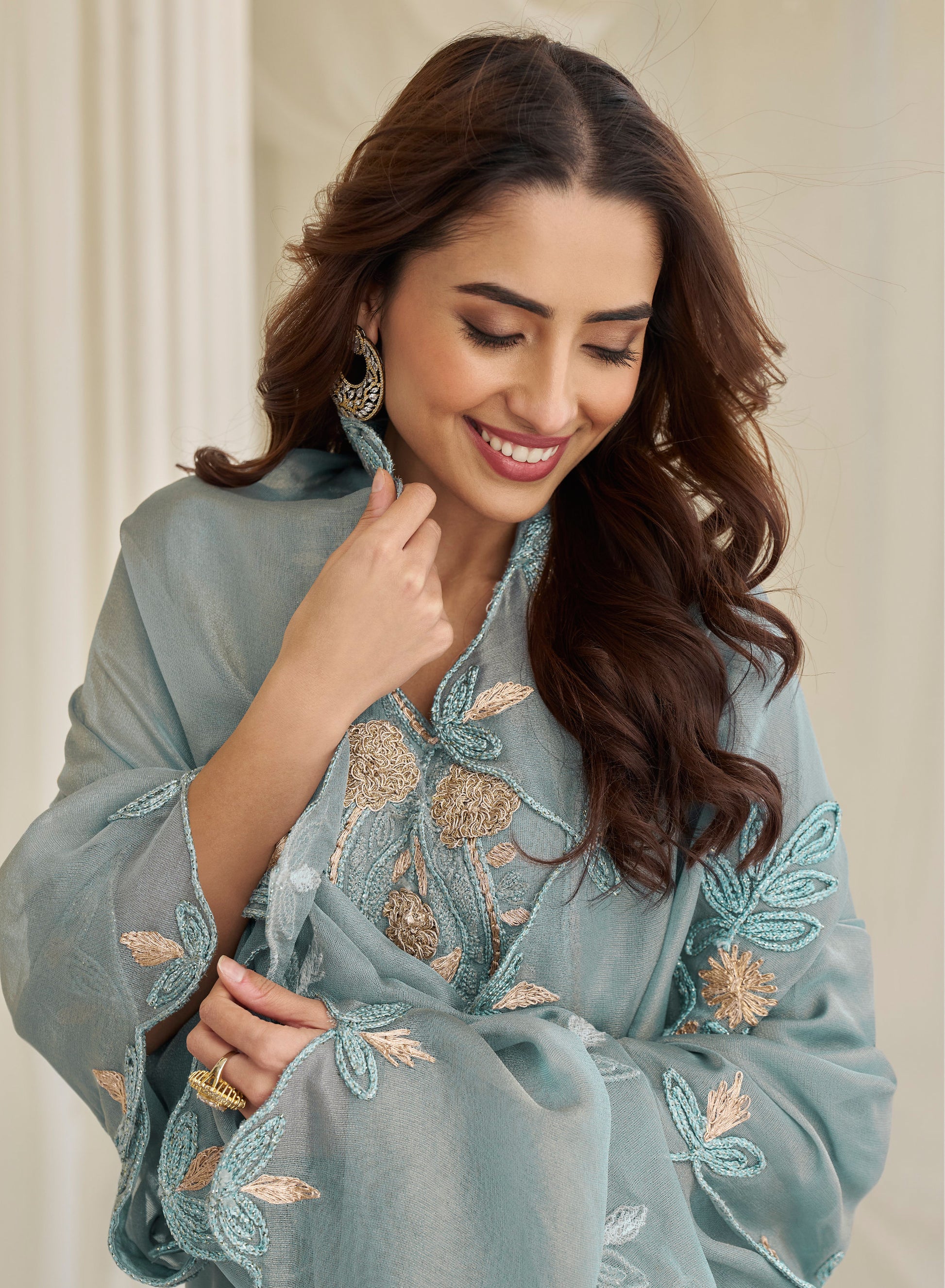 Hemline detail of blue salwar suit with embroidery