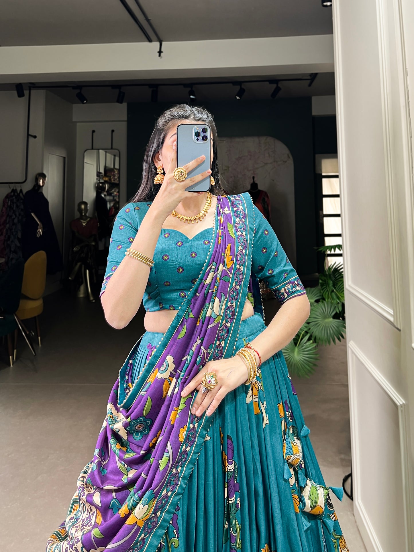 Kalamkari print detail on blue silk lehenga close-up