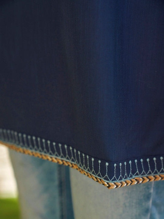 Thread work tunic paired with casual denim look