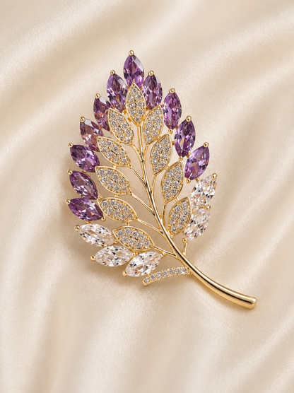 detailed leaf brooch with faceted stone arrangement