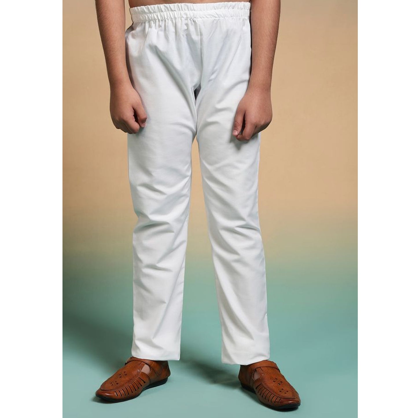 a boy wearing white color pajama which is absolutely free with black kurta