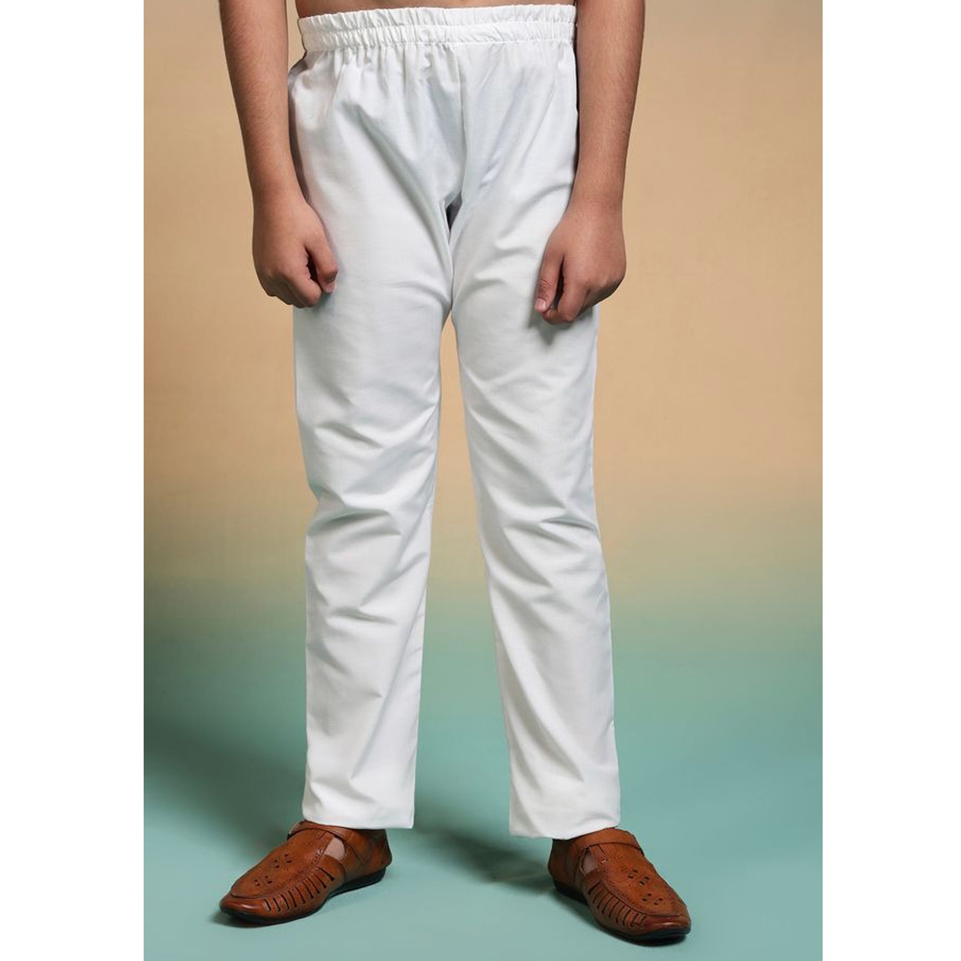 a boy wearing white color pajama which is absolutely free with black kurta